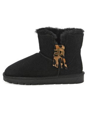 Black suede ankle boot with faux fur lining, rounded toe, and decorative tan and black tassel detail with a gold accent on the side.