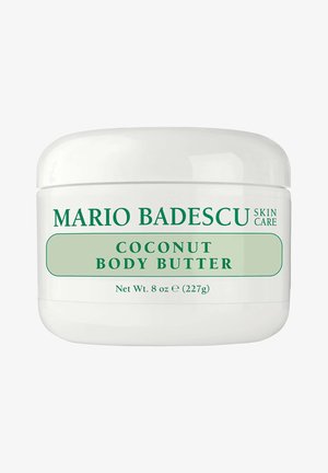 Mario Badescu Coconut Body Butter in a white jar, 8 oz (227g), green text on label showing brand and product name.