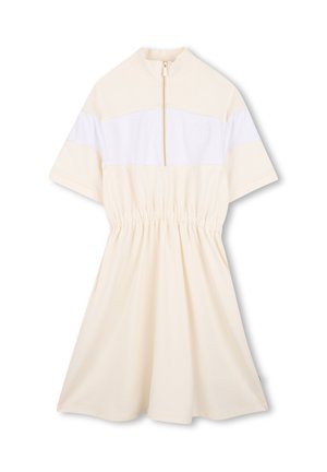 Short-sleeve dress in cream with a white panel, zippered collar, elastic waist, and a minimalist logo stitched on the chest. Soft fabric.