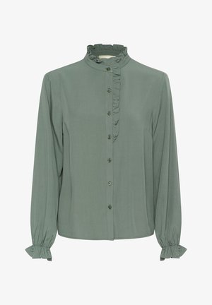 Zöld, hosszú ujjú blúz, ruffled állógallérral, elülső gombos záródással és redőzött mandzsettákkal. Puha, könnyű anyagból készült.