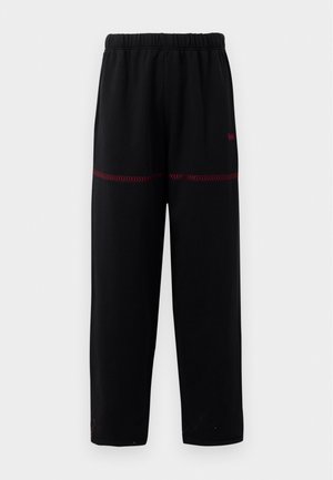 NEUKÖLLN UNISEX - Tracksuit bottoms - black