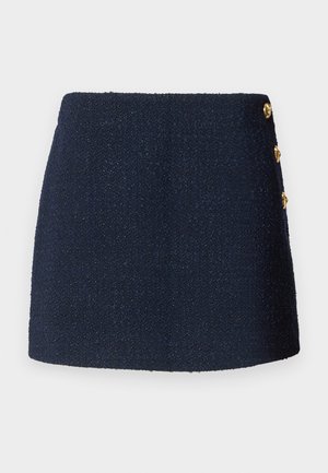 Granatowa, teksturowana mini spódnica z trzema dekoracyjnymi złotymi guzikami z boku.