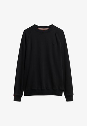 Sweatshirts noirs avec un col ras du cou, des poignets et un ourlet côtelés. Présente des manches raglan et un petit logo sur la poitrine. Texture lisse.