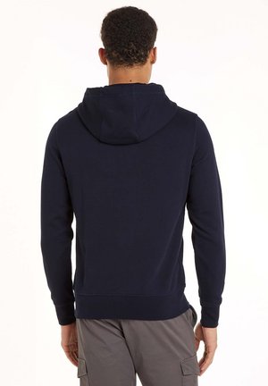 Felpa blu navy con cappuccio, realizzata in tessuto morbido. Caratterizzata da maniche lunghe, polsini a coste e una vestibilità comoda. Vista posteriore mostrata.
