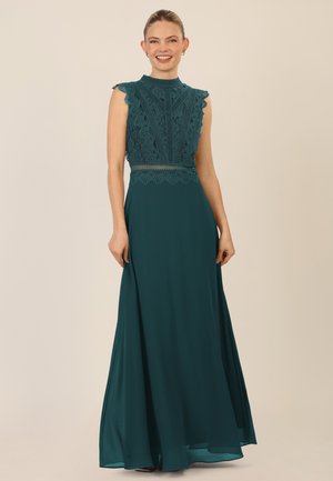 Teal gown with lace bodice and high neckline, featuring scalloped edges and a flowing skirt. Smooth texture and elegant design.