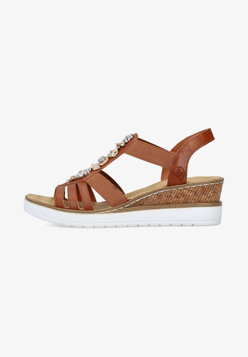 Brown leather wedge sandal with decorative stones, elastic straps, and beige insole. White rubber sole with textured cork accent.
