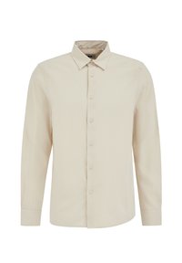 Svetlo béžová blúzka s dlhým rukávom s gombíkovým zapínaním, špicatým golierom a hladkým materiálom. Strih na mieru s zakriveným spodným lemom.