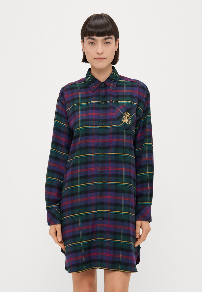 Abito a camicia a scacchi di color verde scuro con righe viola, blu e gialle. Presenta un colletto, maniche lunghe, chiusura a bottoni e taschino sul petto con logo.