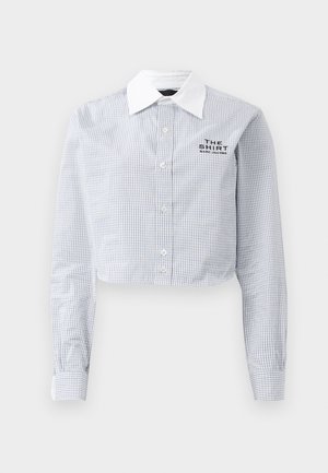 Cropped button-up shirt in blue and white gingham pattern with a white collar. Features the text "THE SHIRT MARC JACOBS" embroidered.