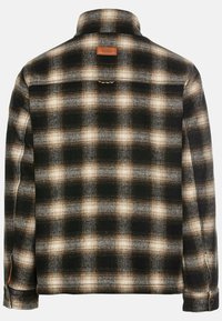 Zwart en beige geruite flanellen shirt, met een kraag, knoopsluiting en een leren merklabel op de achterkant. Zacht, gestructureerd materiaal.