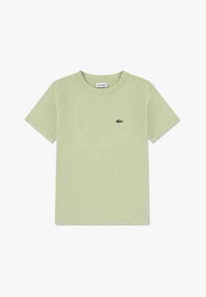 Gaiši zaļa kokvilnas t-krekls ar apaļu apkakli, īsām piedurknēm un nelielu Lacoste logotipu kreisās krūšu augšdaļas pusē. Gluda tekstūra.