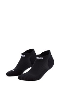 Schwarze Knöchelsocken aus atmungsaktivem Stoff mit gerippter Textur und weißen Logostickereien am Bündchen. Leicht und im niedrigen Schnitt.