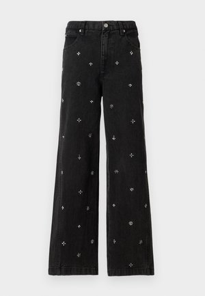 Black wide-leg jeans made of denim featuring intricate silver beading and embroidery in floral and geometric patterns throughout.