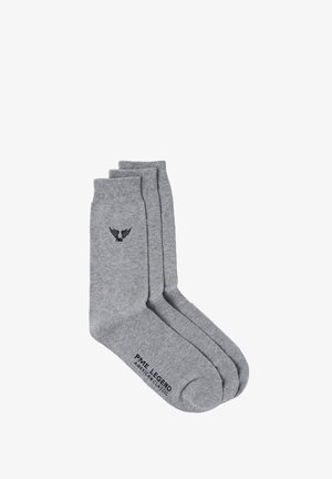 Graue Baumwollsocken mit einer glatten Textur, versehen mit einem schwarzen Logo an der Seite und gerippten Bündchen, entworfen für Komfort und Langlebigkeit.