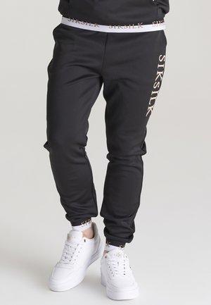 DELUXE - Träningsbyxor - black