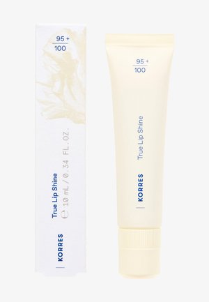 Korres True Lip Shine vaaleassa putkessa, 10 ml, sinisellä tekstillä. Pakkaus sisältää vaalean abstraktin muotoilun valkoisissa ja beigen sävyissä.