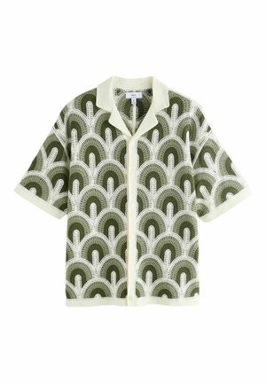 Lühikeste varrukatega avatud kudumiga kardigan rohelise ja valge poolringikujulise mustri ning kreemika kraega, eest nööbitav ja varrukateotsad.