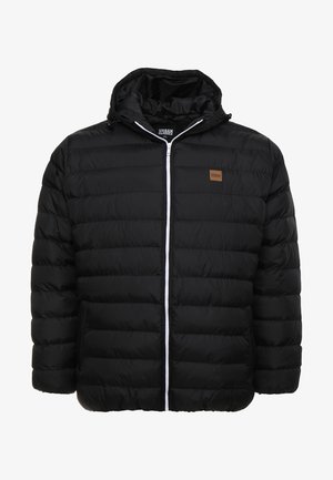 Svart pufferjacka med dragkedja, vadderad design och huva. Har en liten brun logotyp-patch och kontrasterande vit dragkedja.