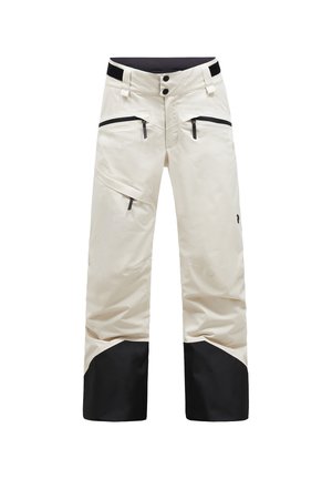 Pantalones de nieve impermeables blancos con detalles negros, dos bolsillos frontales con cremallera y un diseño de pernera ancha. Cuenta con un cierre de botón y velcro.