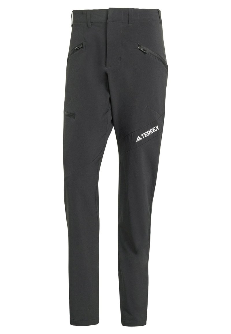 Zwarte softshellbroek met een slim fit, voorzien van ritszakken, schuine naden en een wit TERREX-logo op één been.