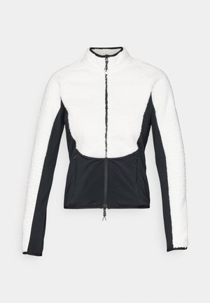 Φούτερ και softshell μπουφάν με λευκό άνω μέρος και μαύρα μανίκια, φερμουάρ μπροστά και υφασμάτινα στοιχεία στους ώμους και τα πλάγια.