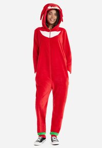 Red fleece onesie with a hood featuring a cartoon face; zip closure, short sleeves, green cuffs at ankle, and soft texture.
