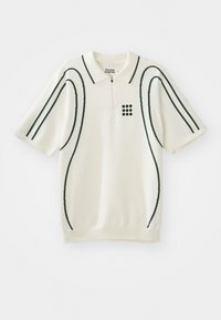 Polo shirt in cream with short sleeves, featuring dark green curved lines and a zip collar. Includes a grid pattern of dark green dots.