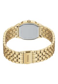 Gold stainless steel wristwatch with octagonal case, interlocking link bracelet, and a clasp marked "FOSSIL." Displaying polished finish and clear back.