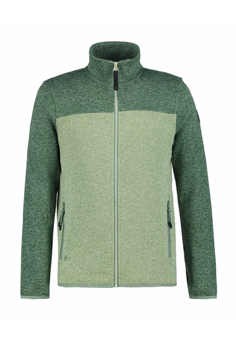 Groene fleecejas met een halve ritssluiting aan de voorkant, hoge kraag, contrasterende boven- en ondersecties, en twee ritszakken aan de zijkanten.