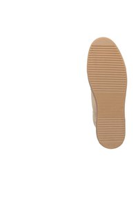 Schoenzool met een gestructureerd beige rubberen oppervlak, met horizontale groeven en een ronde neus. Minimalistisch ontwerp, geen extra details.