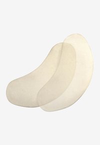 Silikon gelelement i en slät, böjd form med en genomskinlig, ljusbeige färg. Två överlappande padder är synliga, vilket visar en mjuk textur.