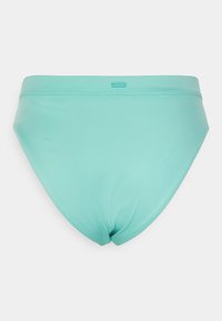 Parte de baixo de bikini verde menta com uma textura suave, corte de altura média e marcação sutil. Design simples, sem padrões ou acabamentos em hardware.