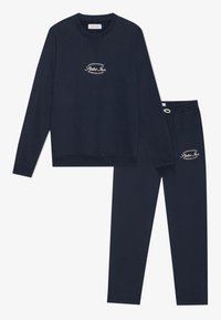 Navyblauwe katoenen sweatshirt met ronde hals en geborduurd logo, gecombineerd met bijpassende broek met elastische tailleband en logo-details.