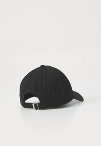 Black baseball cap with a curved brim, adjustable metal buckle strap at the back, and a textured fabric surface.
