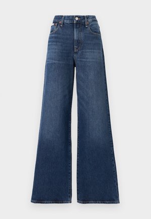 Høyt midjer, vide jeans laget av mørkeblå denim, med knappelukking, fem lommer og subtil falming på lårene.