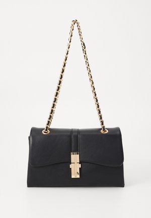 Black leather handbag with a gold chain strap, rectangular shape, magnetic closure, and a smooth texture. Features a decorative gold hardware accent.