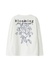 Weißes Langarmhemd mit einem blauen floralen Skizze und dem Text "Blühen und Wachsen" auf der Rückseite bedruckt.