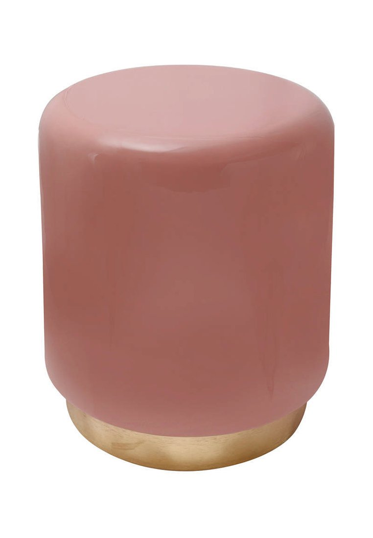 Tabouret rond en matériau pastel rose brillant avec une surface lisse et une base dorée, présentant un design cylindrique simple.