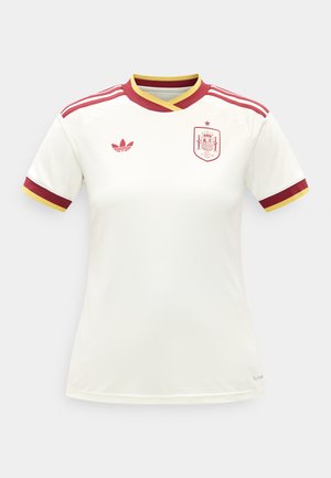 Espanjan kansallisen jalkapallopaidan valkoinen malli, jossa on punaiset ja keltaiset reunukset, Adidas-logo ja Espanjan joukkueen vaakuna rinnassa.