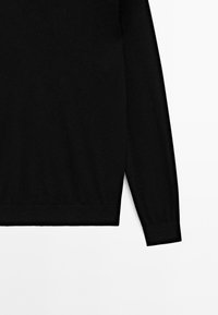 Black long-sleeve sweatshirt made of soft fabric, featuring ribbed cuffs and a straight hem, offering a simple and minimalistic design.