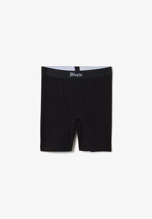 Schwarze Baumwoll-Boxershorts mit eng anliegendem Schnitt, ausgestattet mit einem Bund, der in weißem Text mit "Utopia" beschriftet ist. Weicher Stoff und gerade geschnittenes Design.