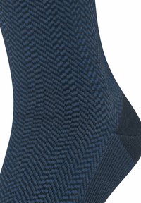 Calze blu navy con motivo a zigzag, tessuto a maglia testurizzato, tallone e punta rinforzati, con una parte superiore a maglia liscia.