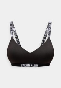 Μαύρο ασύρματο σουτιέν με λευκό λογότυπο Calvin Klein στα λουράκια και στη ζώνη κάτω από το στήθος, λείες καλυμμένες cups και ρυθμιζόμενα λουριά ώμων.