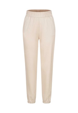 Light beige jogger pants made of soft fabric, featuring an elastic waistband and tapered cuffs at the ankles. Smooth texture and simple design.