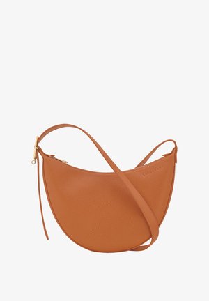 Brown leather crossbody bag with a curved shape, textured surface, and a gold-tone zipper accent. Adjustable strap for versatility.