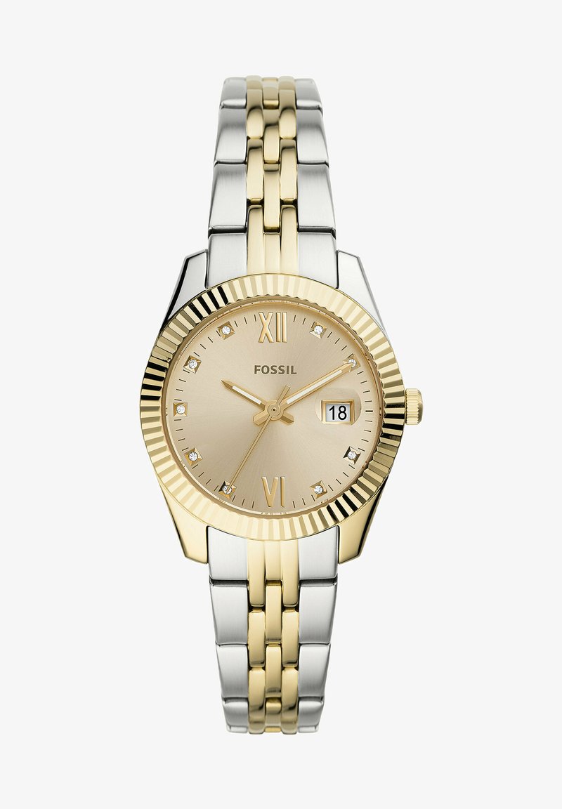 Montre-bracelet Fossil avec un bracelet en acier inoxydable doré et argenté, un cadran rond couleur or, des chiffres romains, un affichage de la date et des accents en cristal.