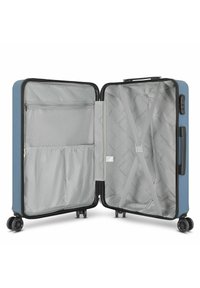 Valigia rigida blu, con interno grigio dotato di tasca in rete e cinghie incrociate. Quattro ruote nere per la mobilità. Chiusura con zip.