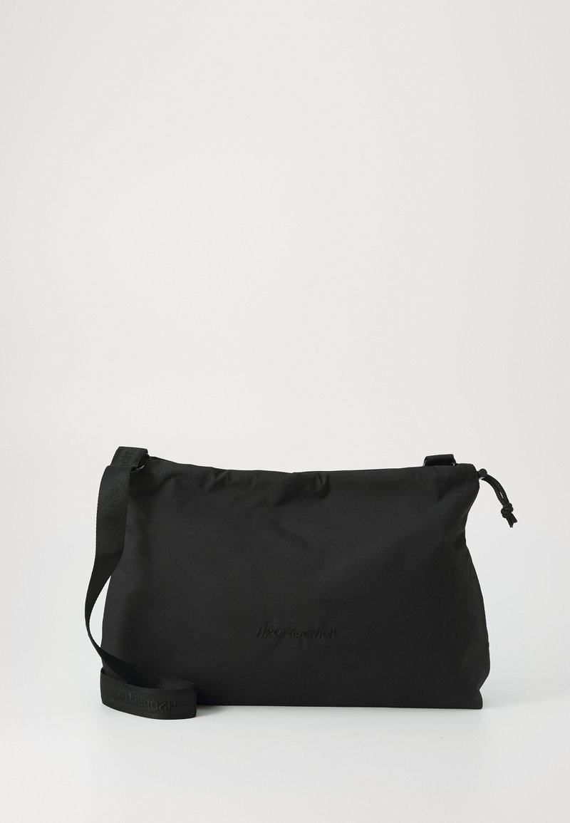 Black crossbody bag made of lightweight fabric, featuring a sleek, rectangular shape, adjustable strap, and embossed logo on the front.