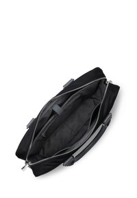 Borsa nera con zip superiori, hardware grigia e un interno in tessuto morbido dotato di diverse tasche per l'organizzazione.