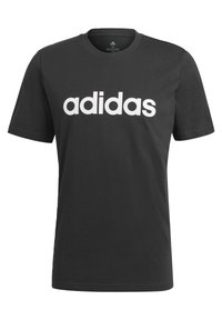 Mustapaita, jossa on pyöreä kaula-aukko ja lyhyet hihat. Etuosassa on suuressa koossa valkoinen "adidas"-logo.